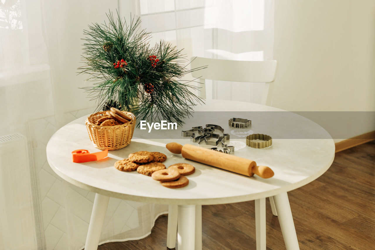 Christmas or new year's pastries on a table decorated with pine branches. christmas, gingerbread