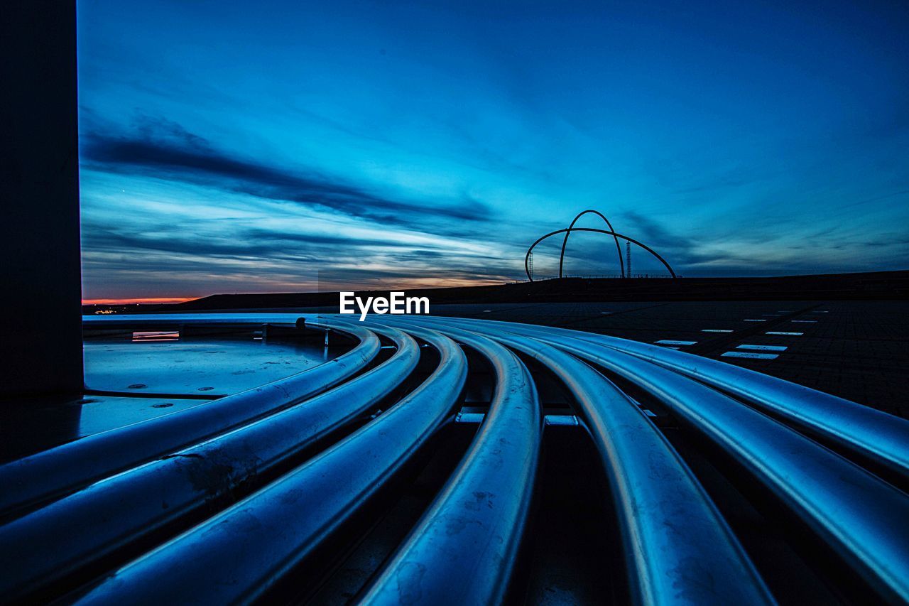 Light trails on blue sky at night