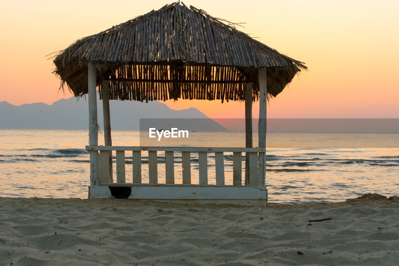 LIFEGUARD HUT ON BEACH DURING SUNSET