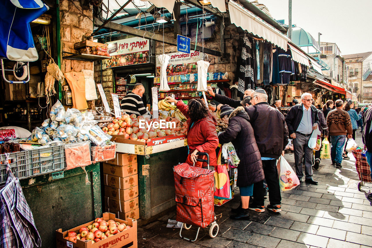 PEOPLE FOR SALE AT MARKET STALL