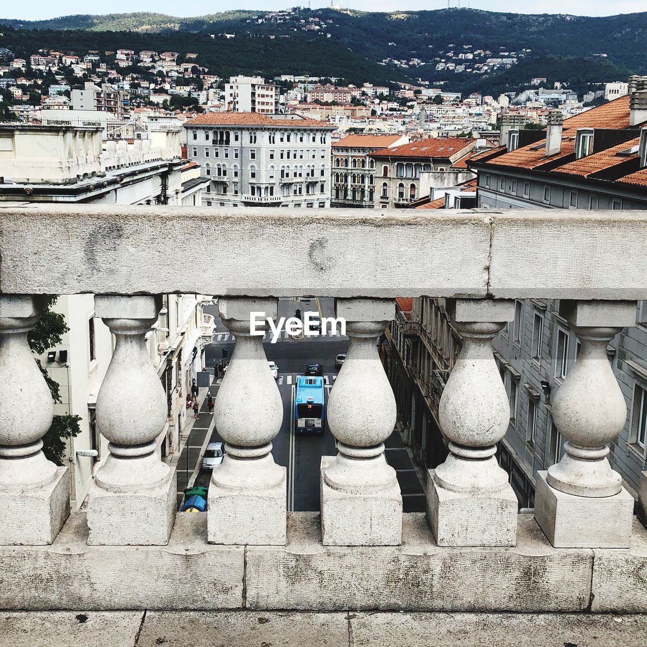 Railing against buildings in city