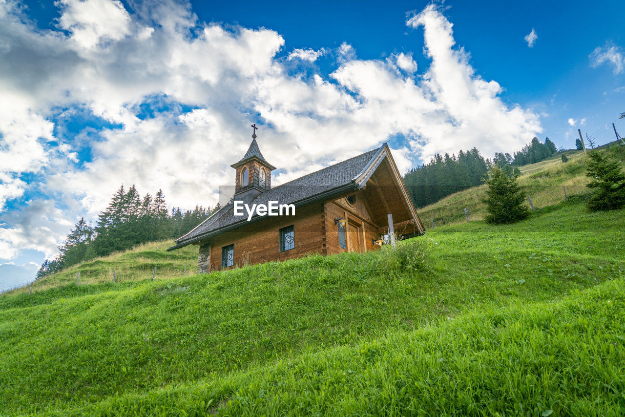 built structures on field against sky