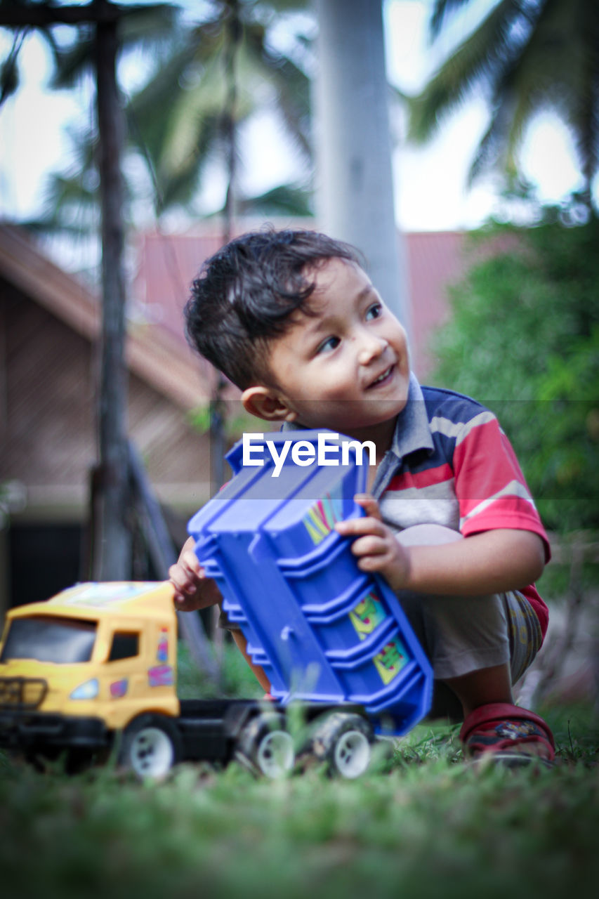 Portrait of cute boy with toy