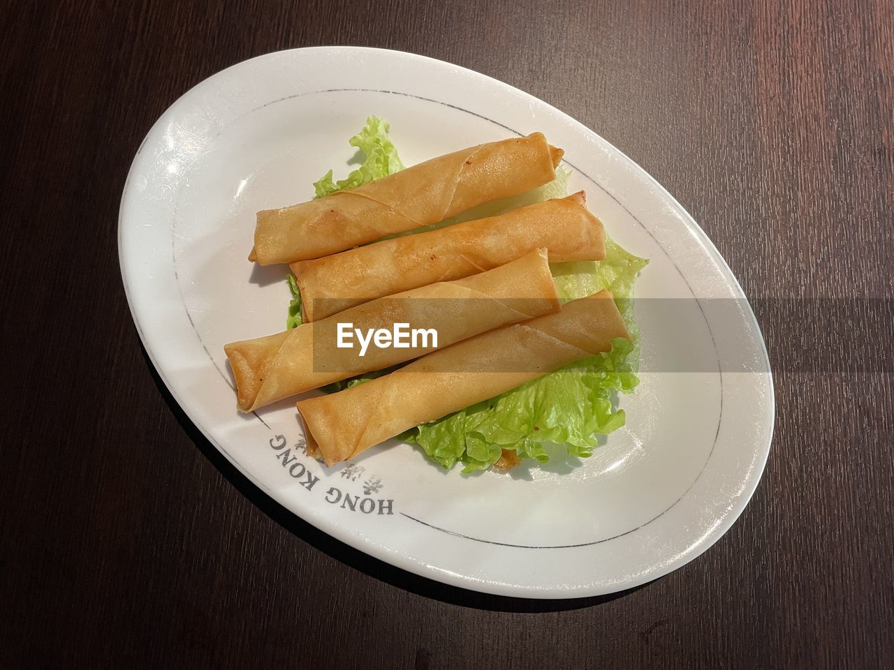 food, food and drink, fast food, lumpia, healthy eating, spring roll, taquito, freshness, plate, vegetable, wellbeing, no people, dish, indoors, table, egg roll, wood, studio shot, cuisine, snack, high angle view, produce, still life, fish, close-up