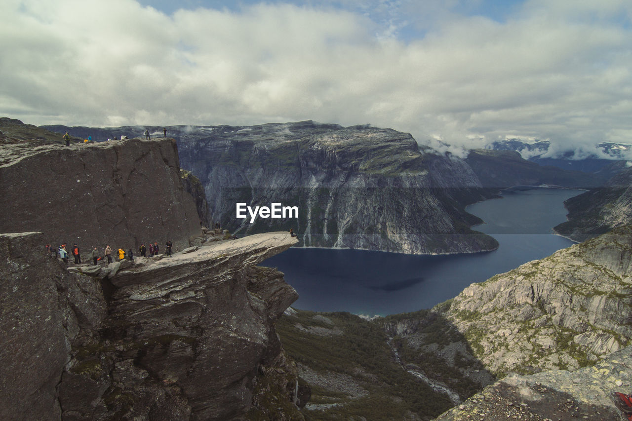 Tourists on troll tongue cliff landscape photo