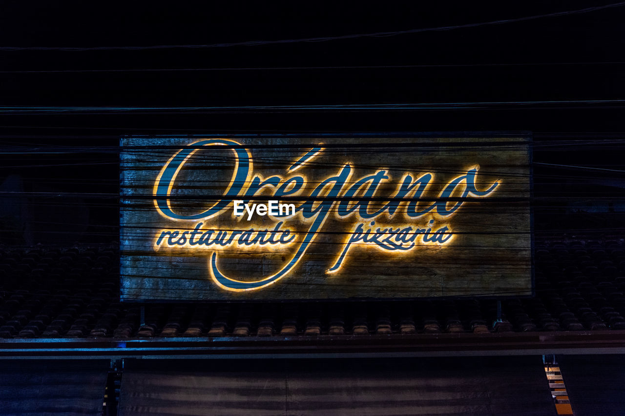 TEXT WRITTEN ON ILLUMINATED STORE