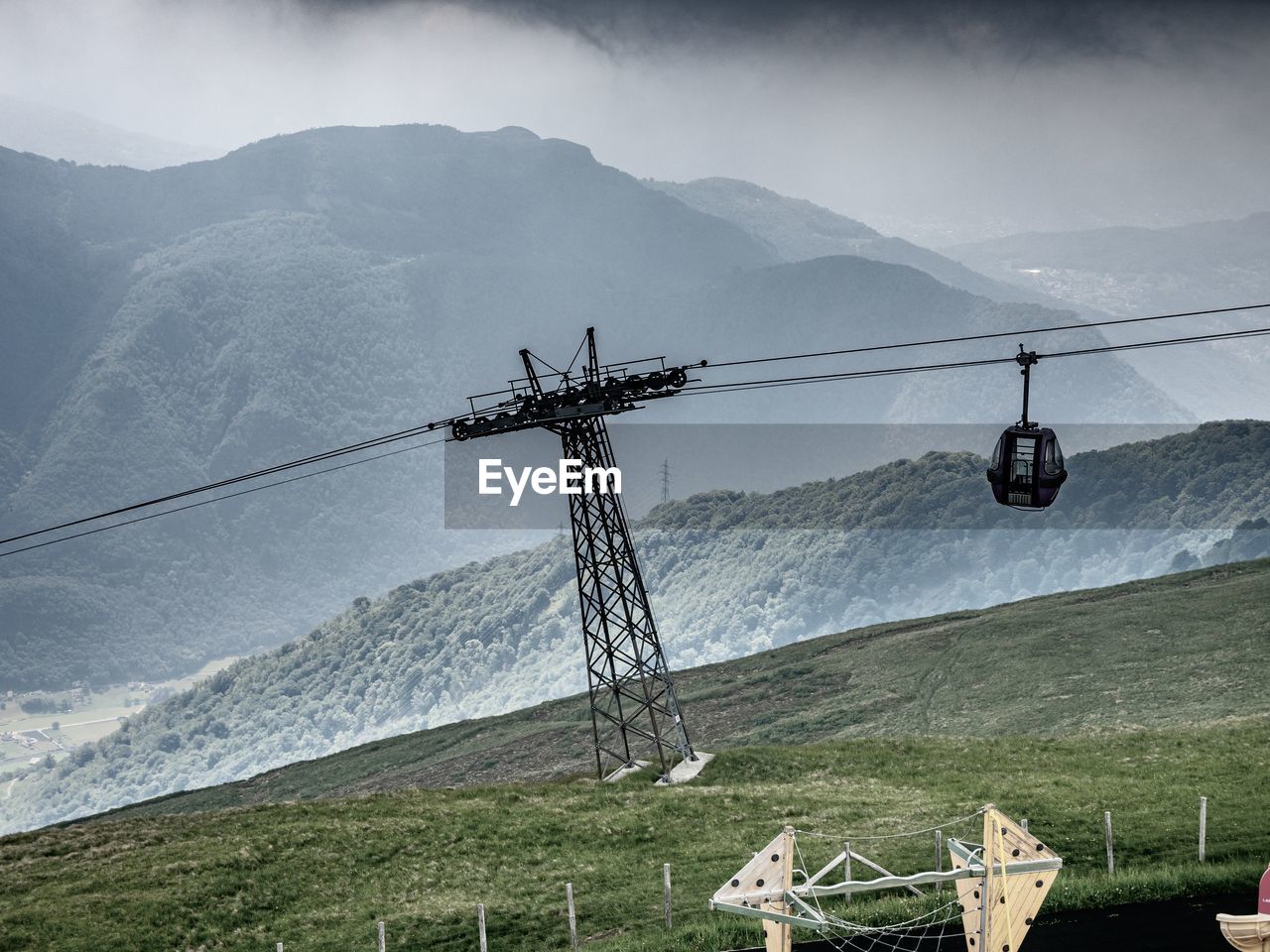 OVERHEAD CABLE CAR OVER MOUNTAINS