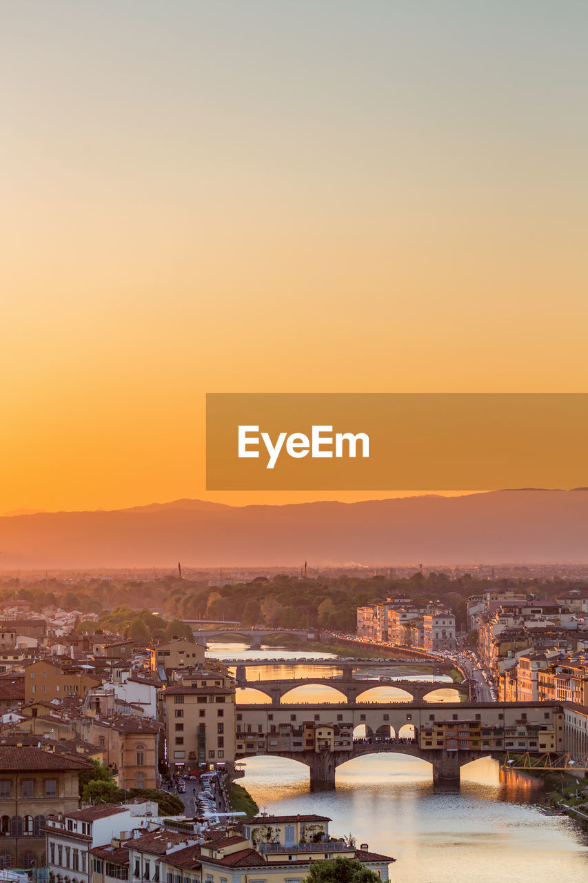 Beautiful sunset view at ponte vecchio in florence