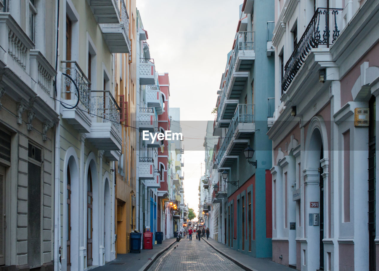 Street amidst buildings against sky