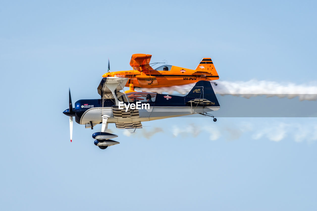 LOW ANGLE VIEW OF AIRPLANE AGAINST CLEAR SKY