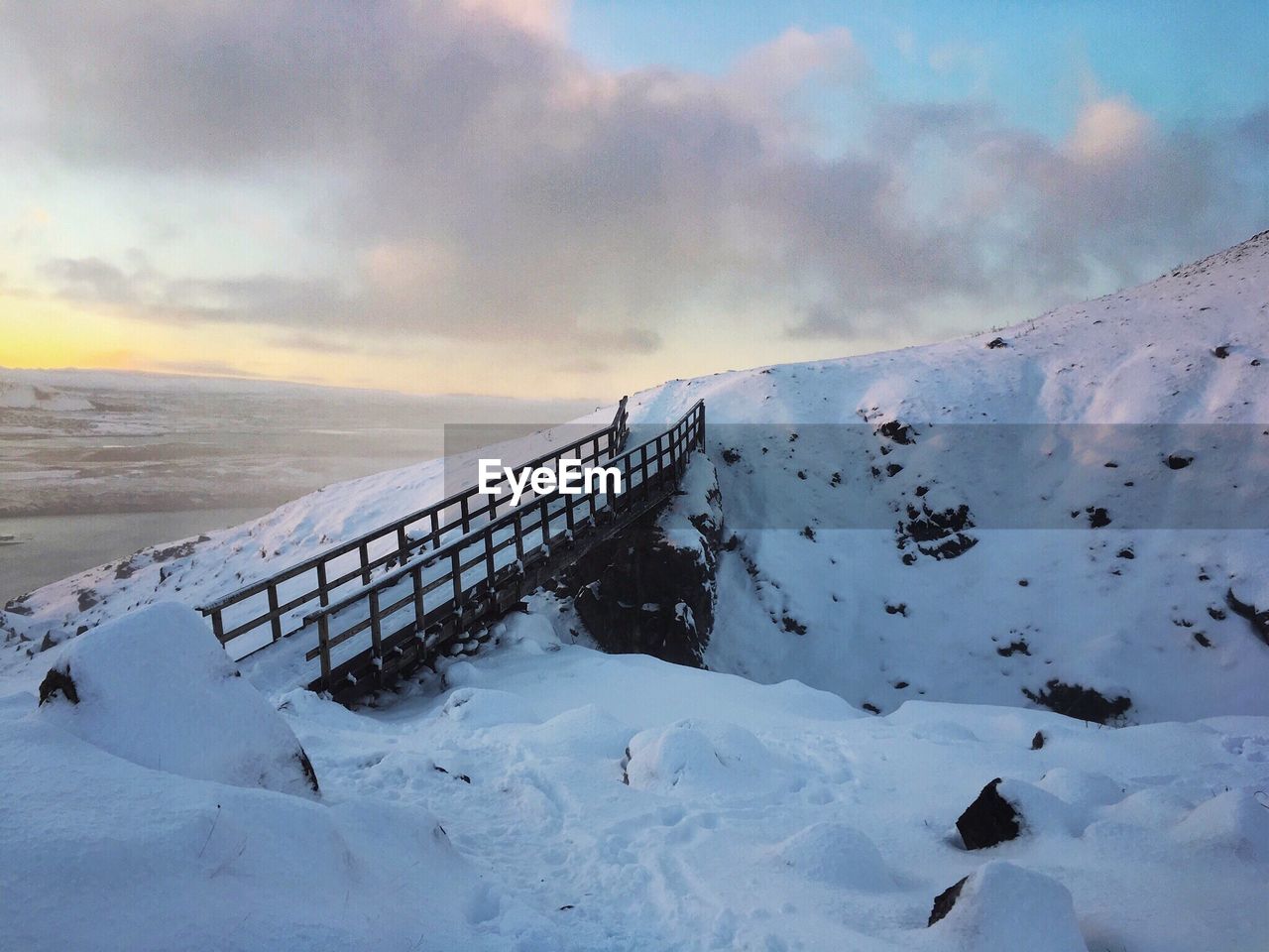 Scenic view of snow covered mountain against sky