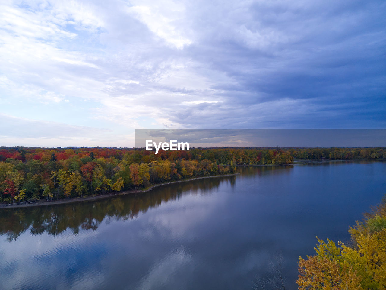 Scenic view of lake against sky during autumn