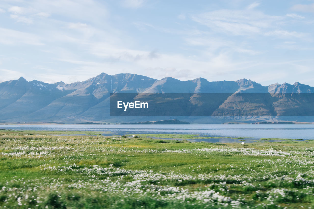 Scenic view of lake with mountains in background