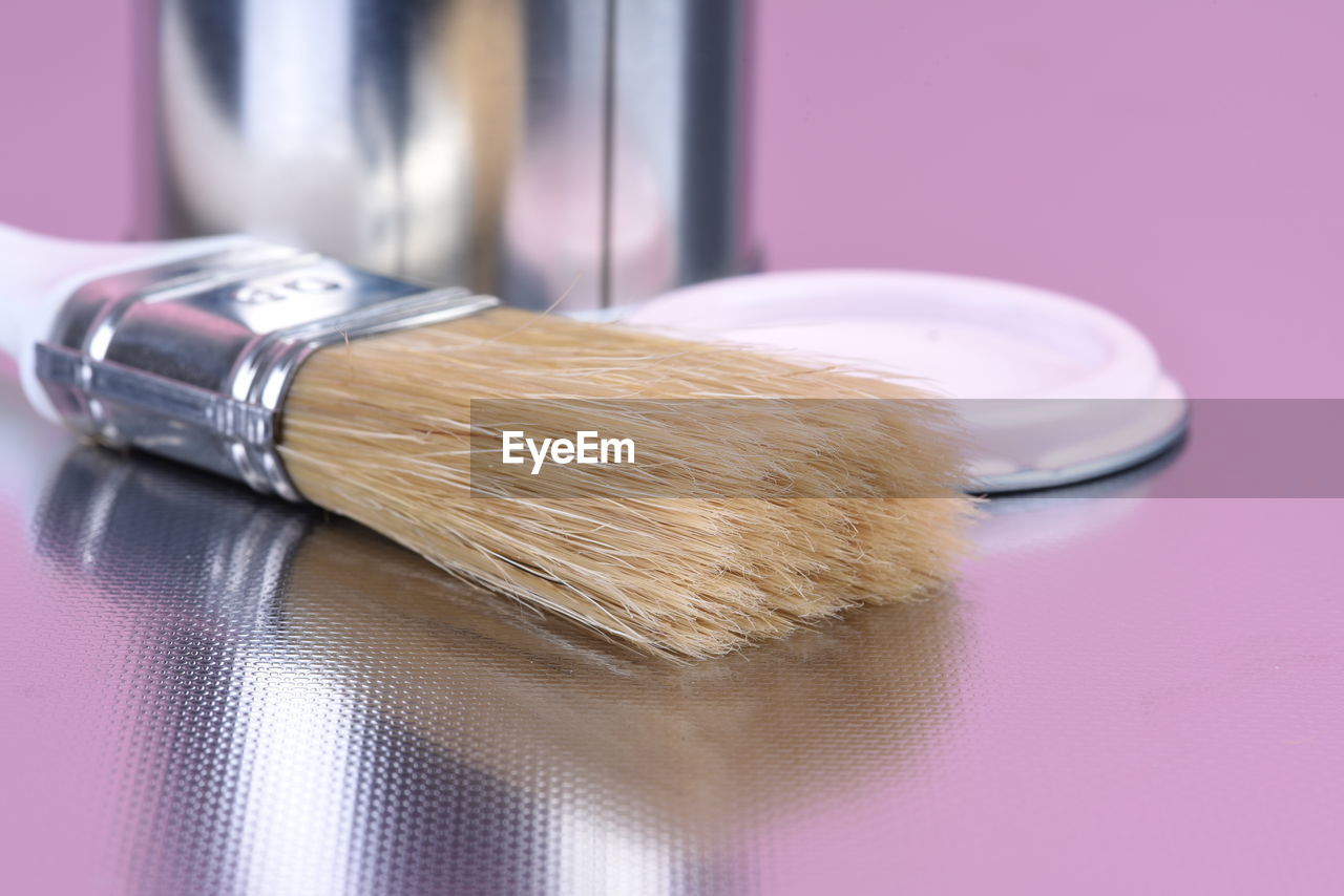 Close-up of paintbrush on table