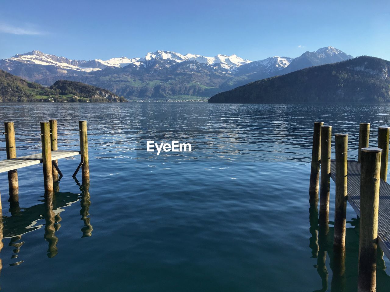 Scenic view of lake and mountains against sky