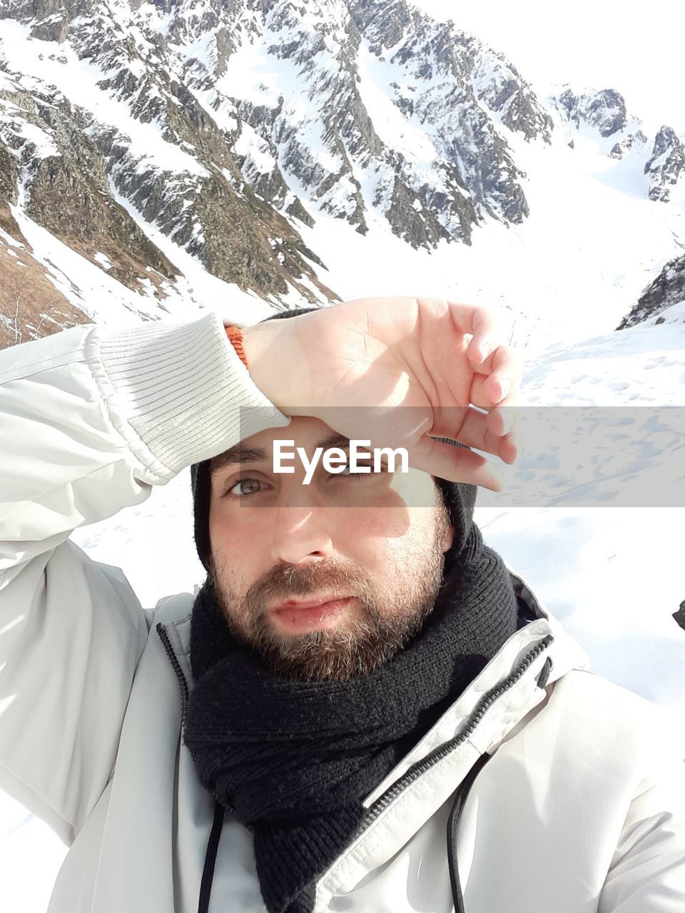 Portrait of young man in snow