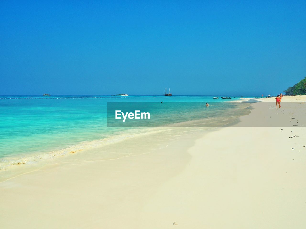 View of beach against blue sky