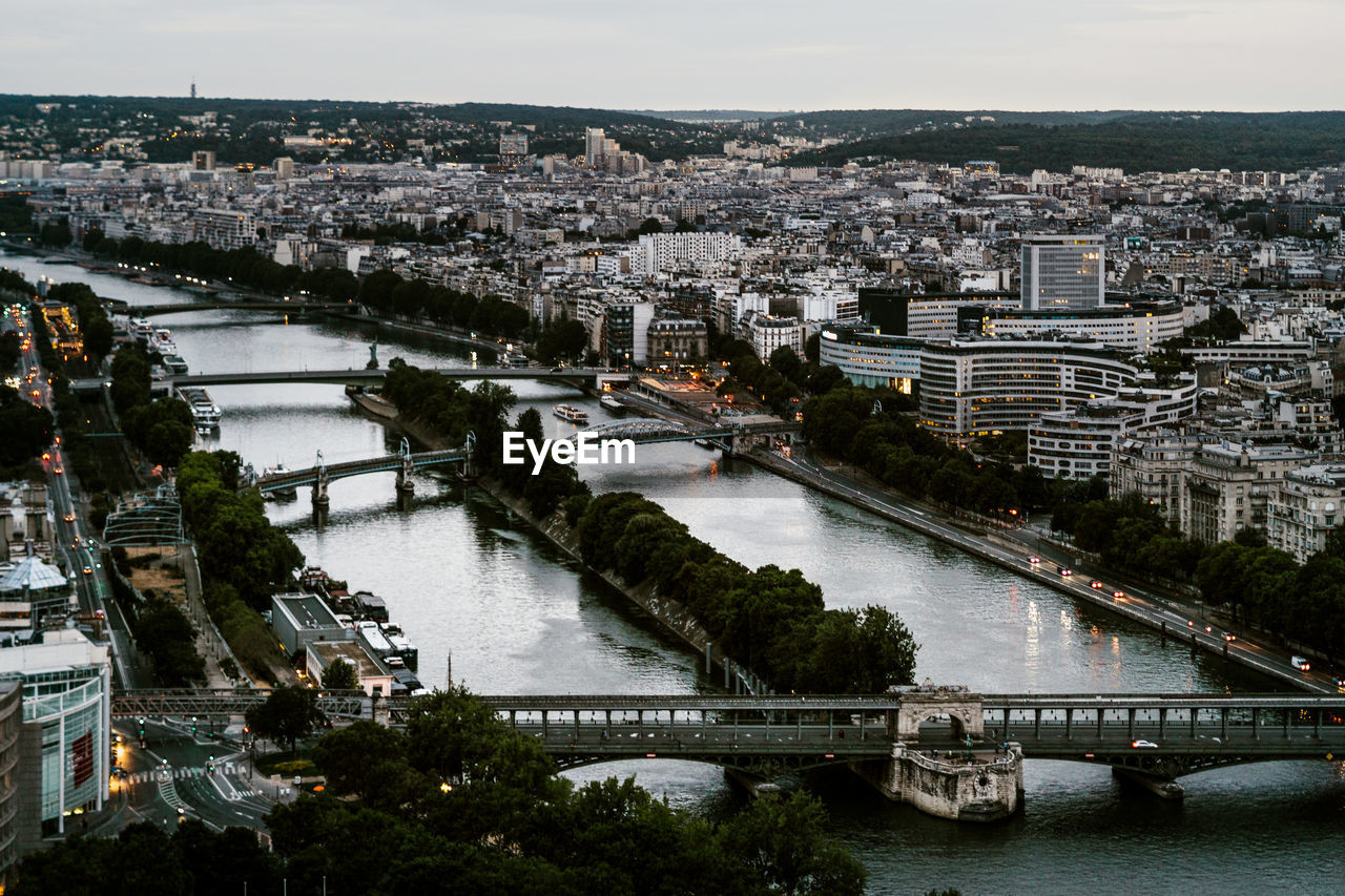 High angle view of bridge over river and buildings in city