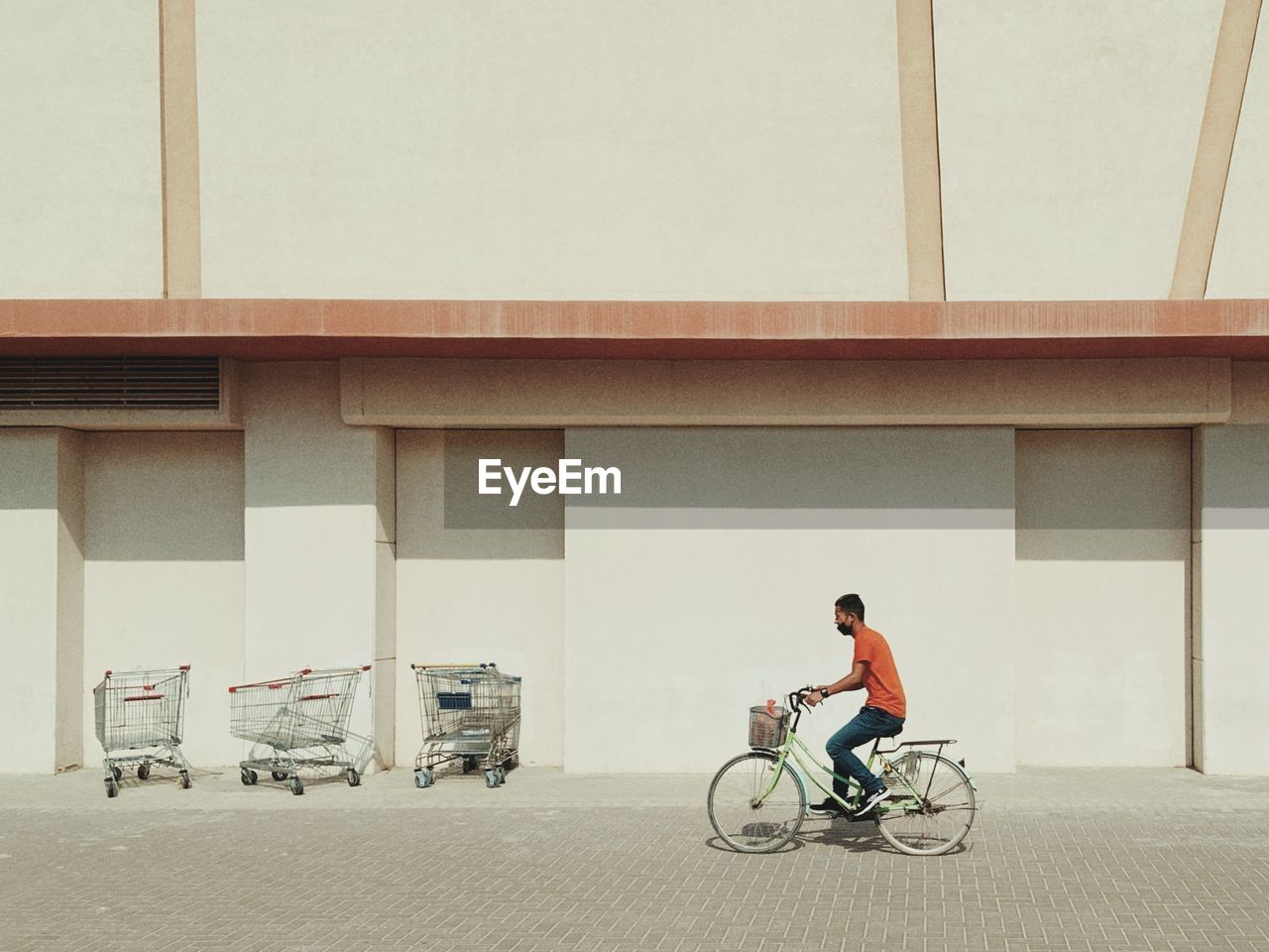 Man riding bicycle on street in city