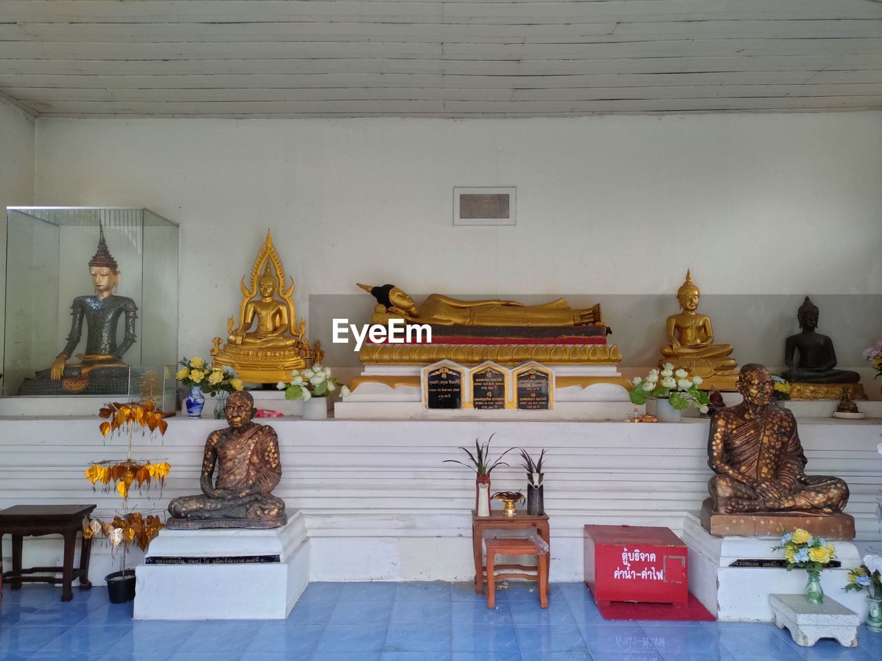 religion, belief, spirituality, architecture, temple - building, sculpture, travel destinations, building, place of worship, built structure, travel, statue, history, indoors, the past, no people, gold, human representation, pagoda, tradition, male likeness, culture, tourism, craft