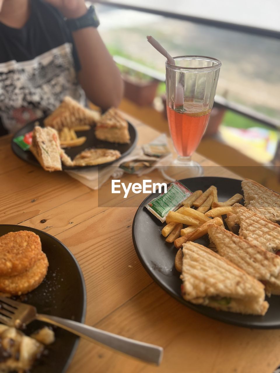 food and drink, food, snack, fast food, drink, refreshment, glass, meal, bread, dish, table, breakfast, alcohol, brunch, freshness, household equipment, indoors, baked, adult, drinking glass, one person, lifestyles, healthy eating, meat, plate, women, sandwich, cookie, wine, raw potato, waffle, day, vegetable, kitchen utensil, selective focus, lunch