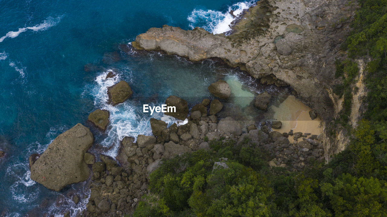 High angle view of rock formation in sea