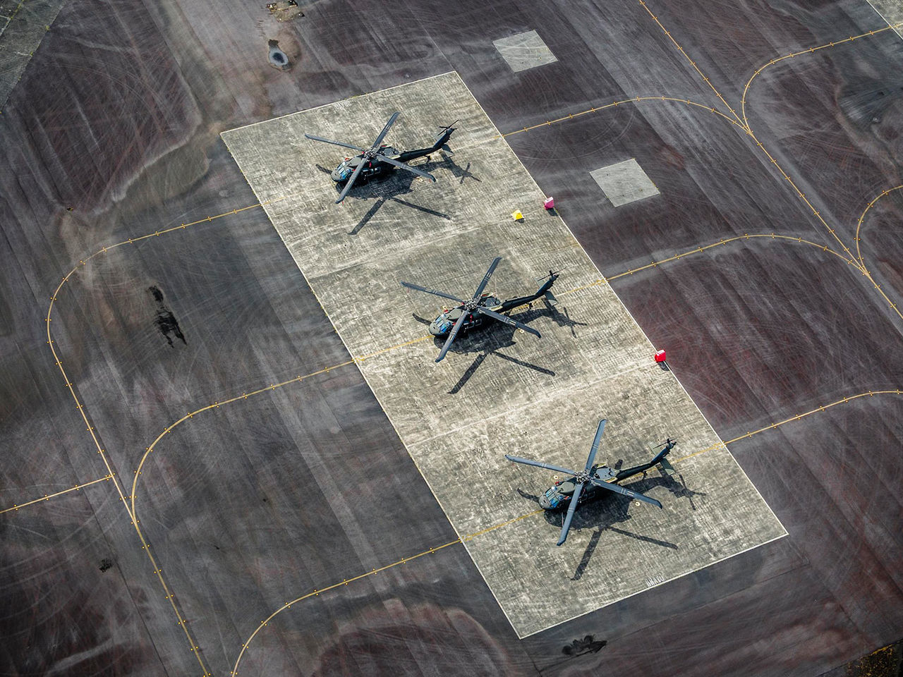 Aerial view of helicopters at helipad