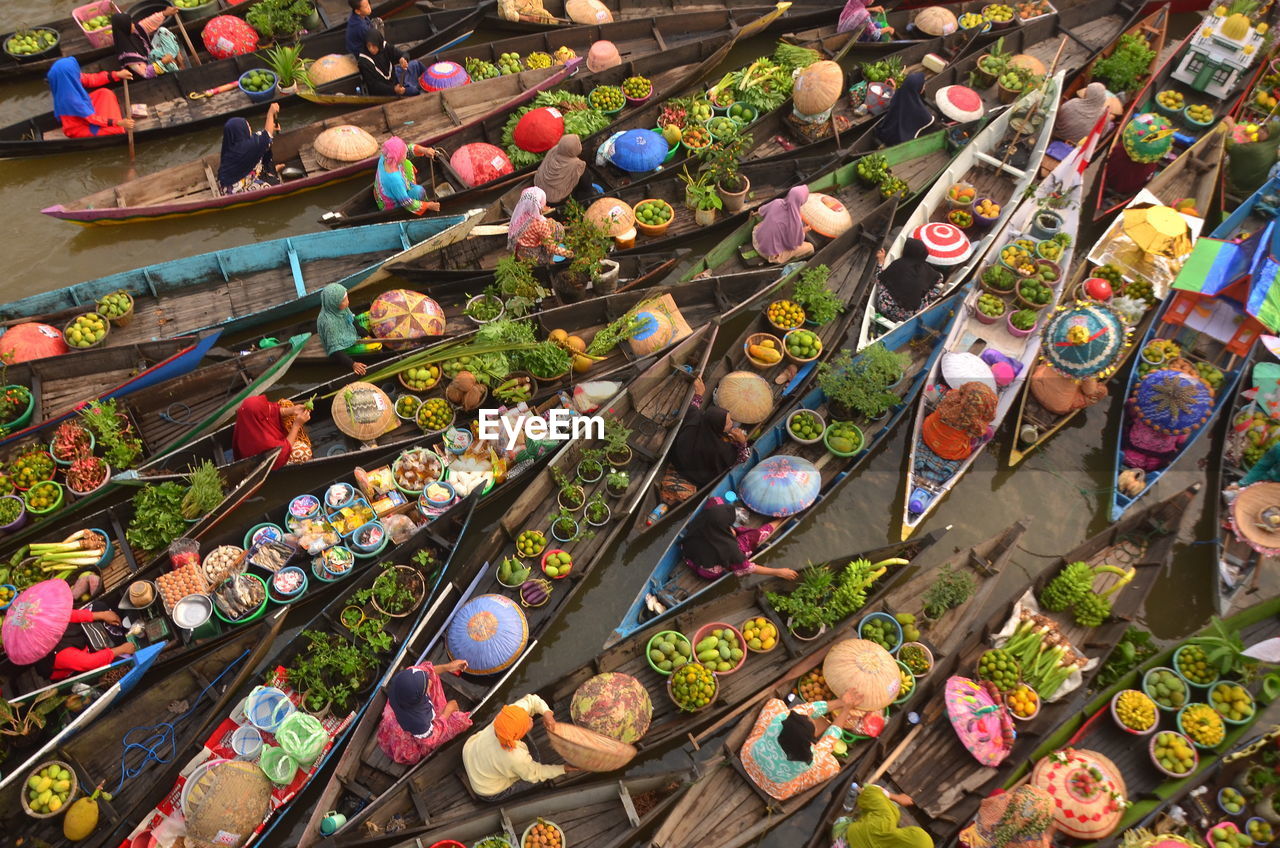 High angle view of people at floating market stall