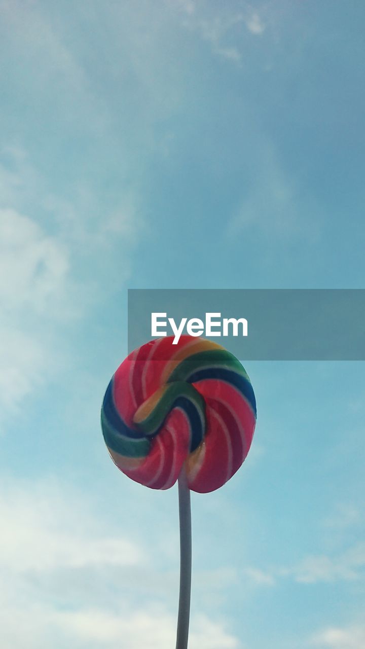 Lollypop against blue sky