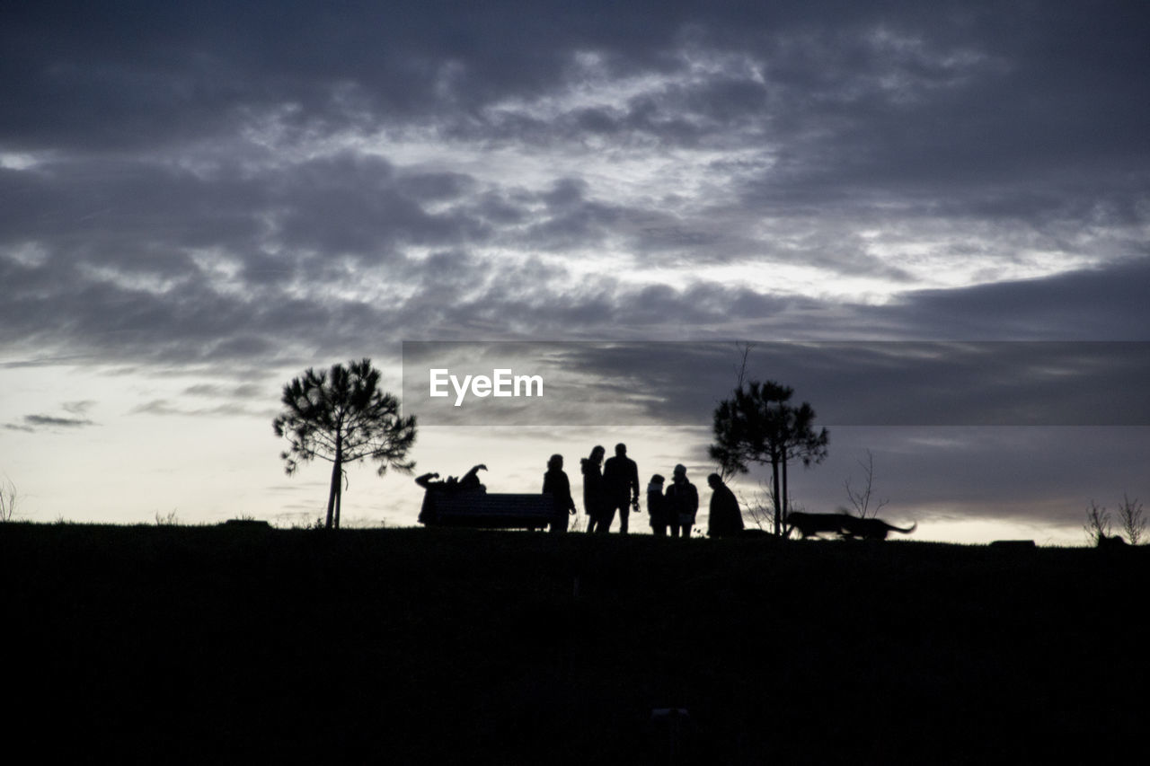 SILHOUETTE MEN AND PEOPLE AGAINST CLOUDY SKY