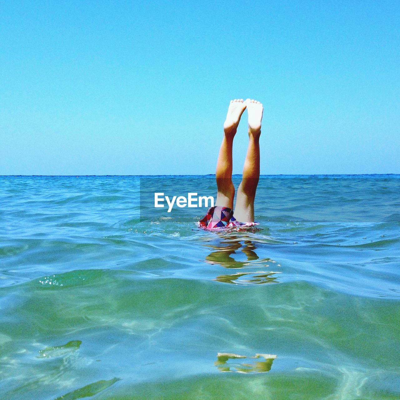 Woman diving in sea