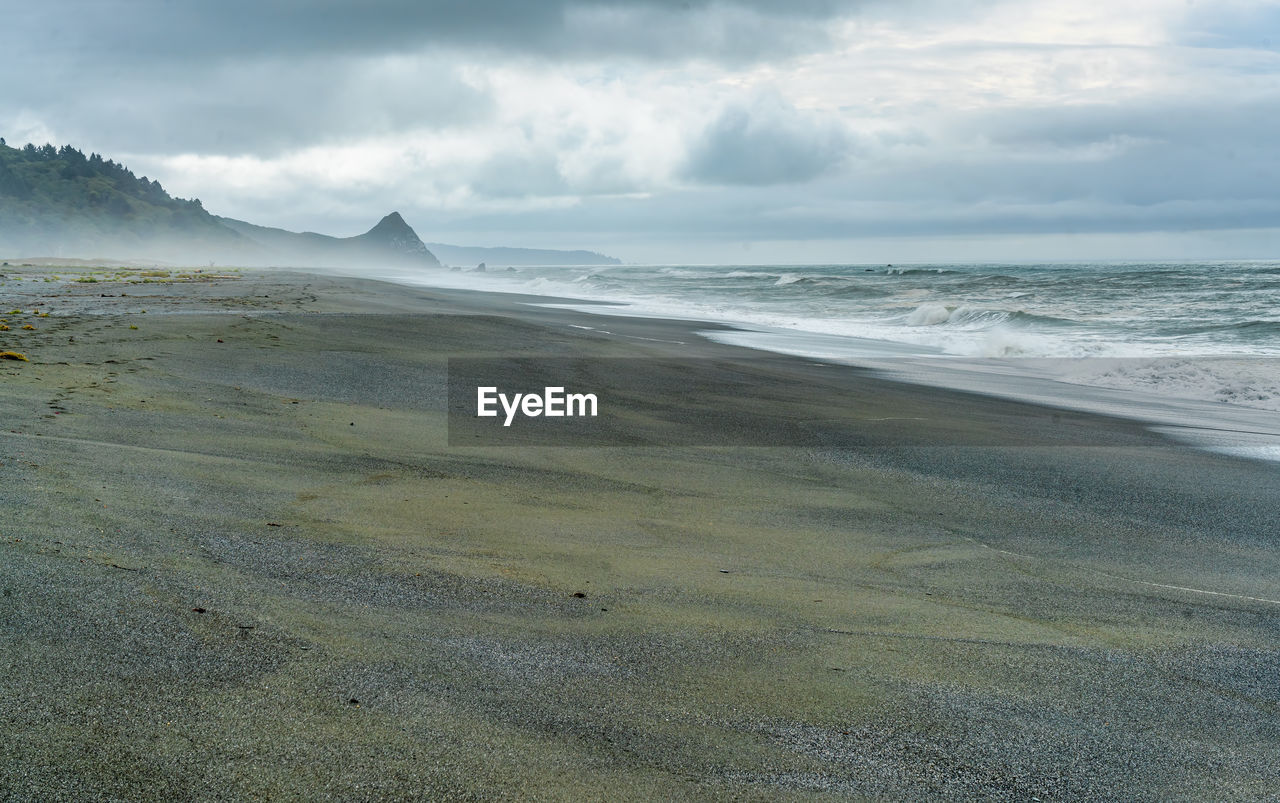 A view of the beach at humboldt lagoons state park in california on an overcast day.