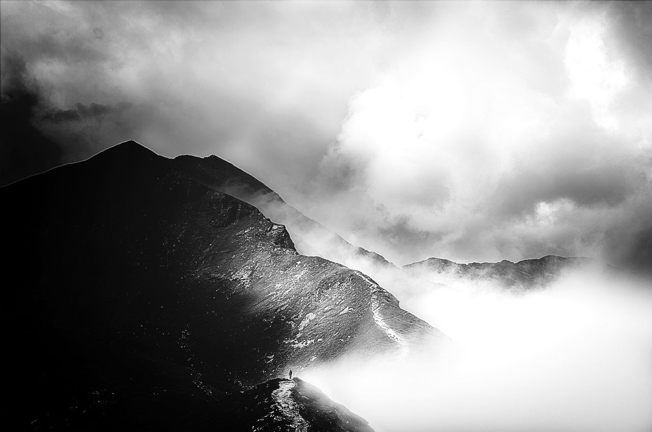 Low angle view of mountains during foggy weather