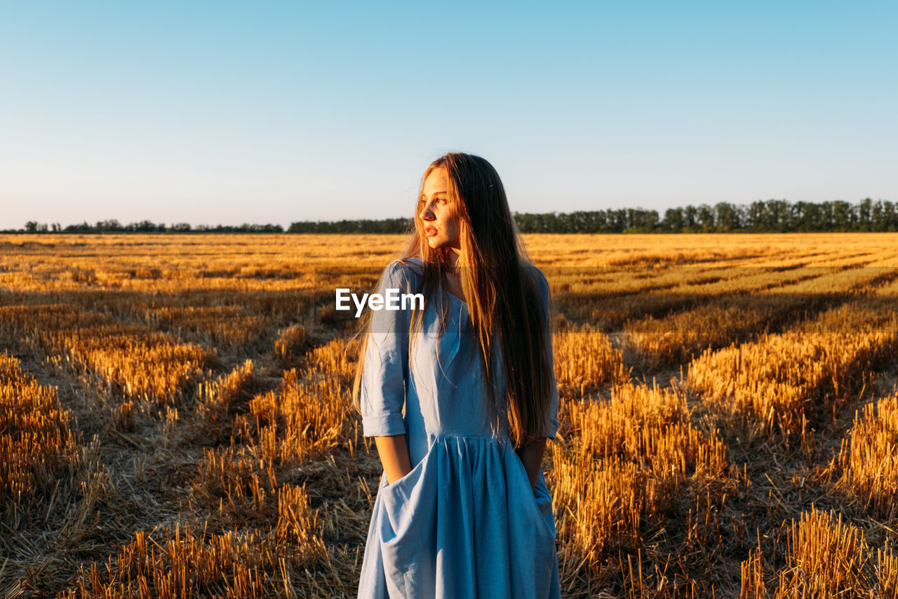 Escapism, getting away from it all, mental health, stress resilience. alone young woman in linen