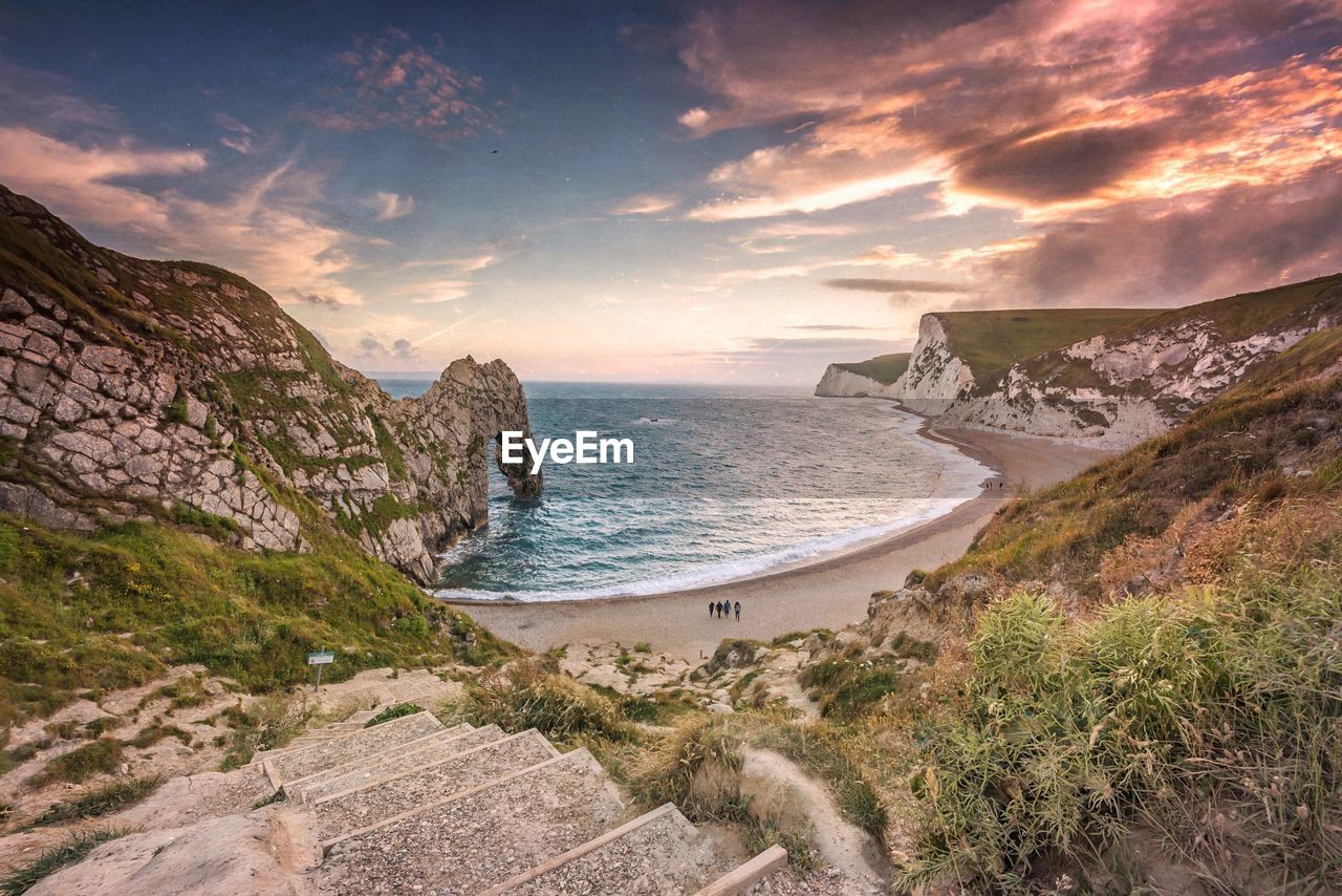 Scenic view of durdle door during sunset