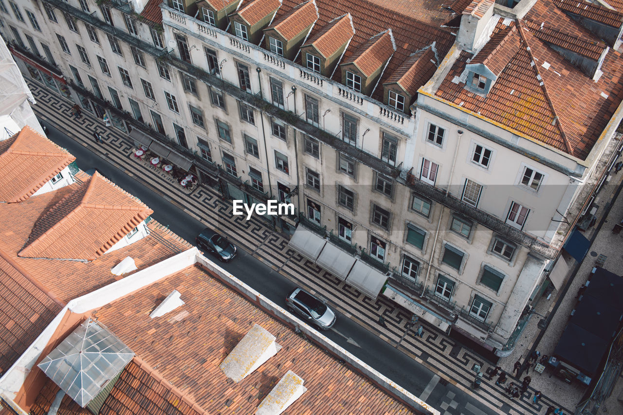 High angle view of railroad tracks amidst buildings in city