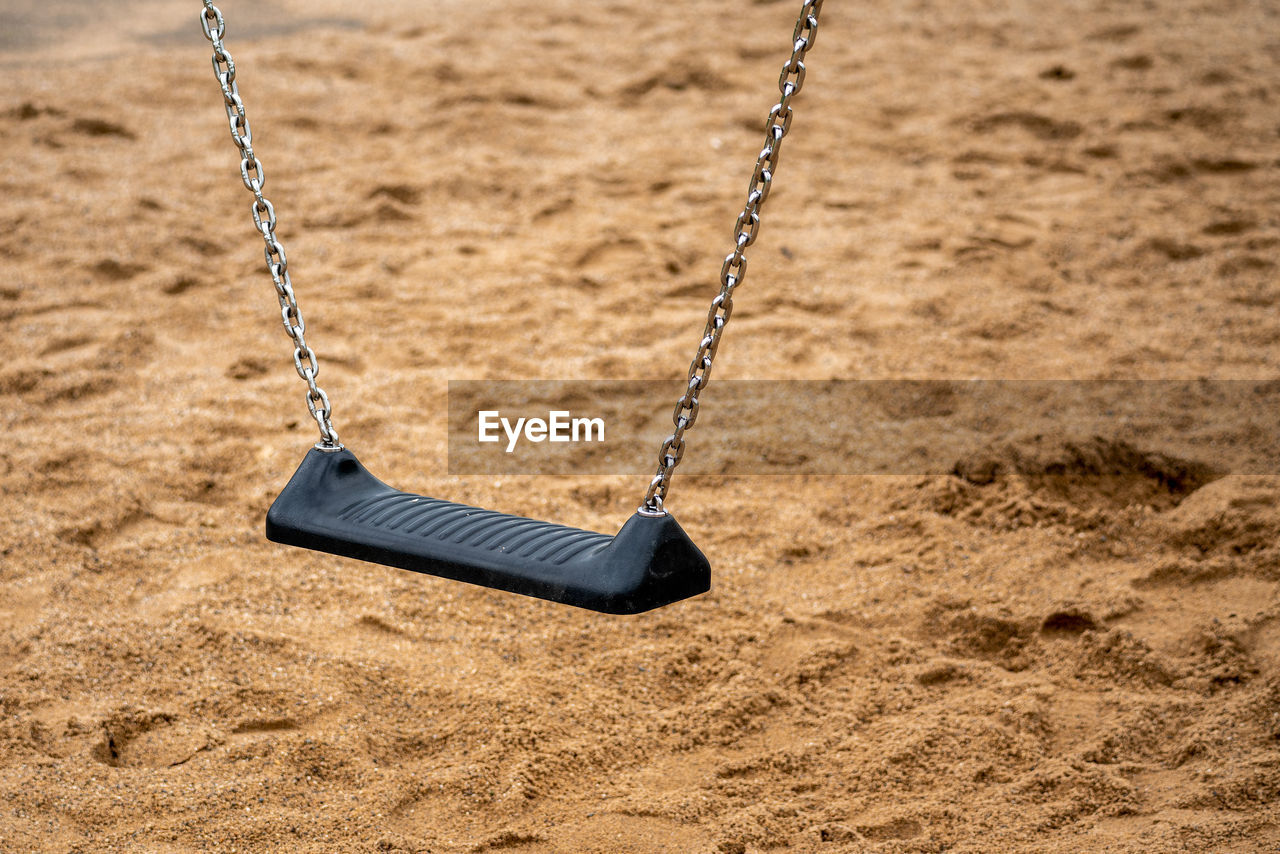 Empty swing on the children's playground