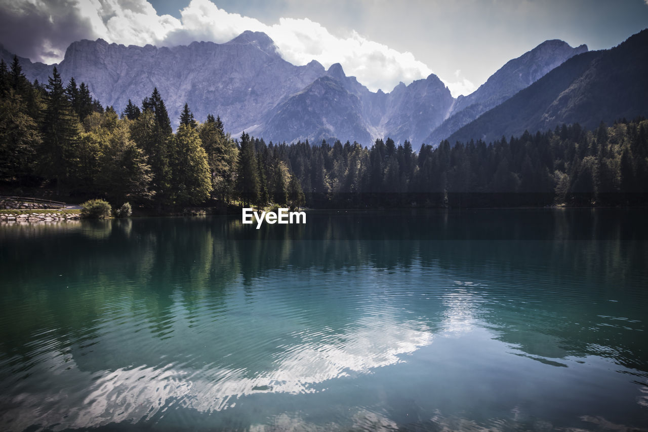 Scenic view of lake and mountains against sky