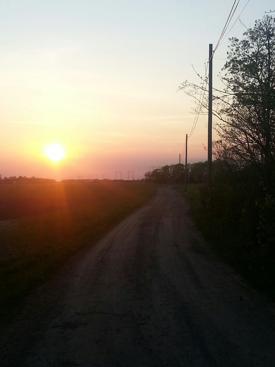 Dirt road at sunset