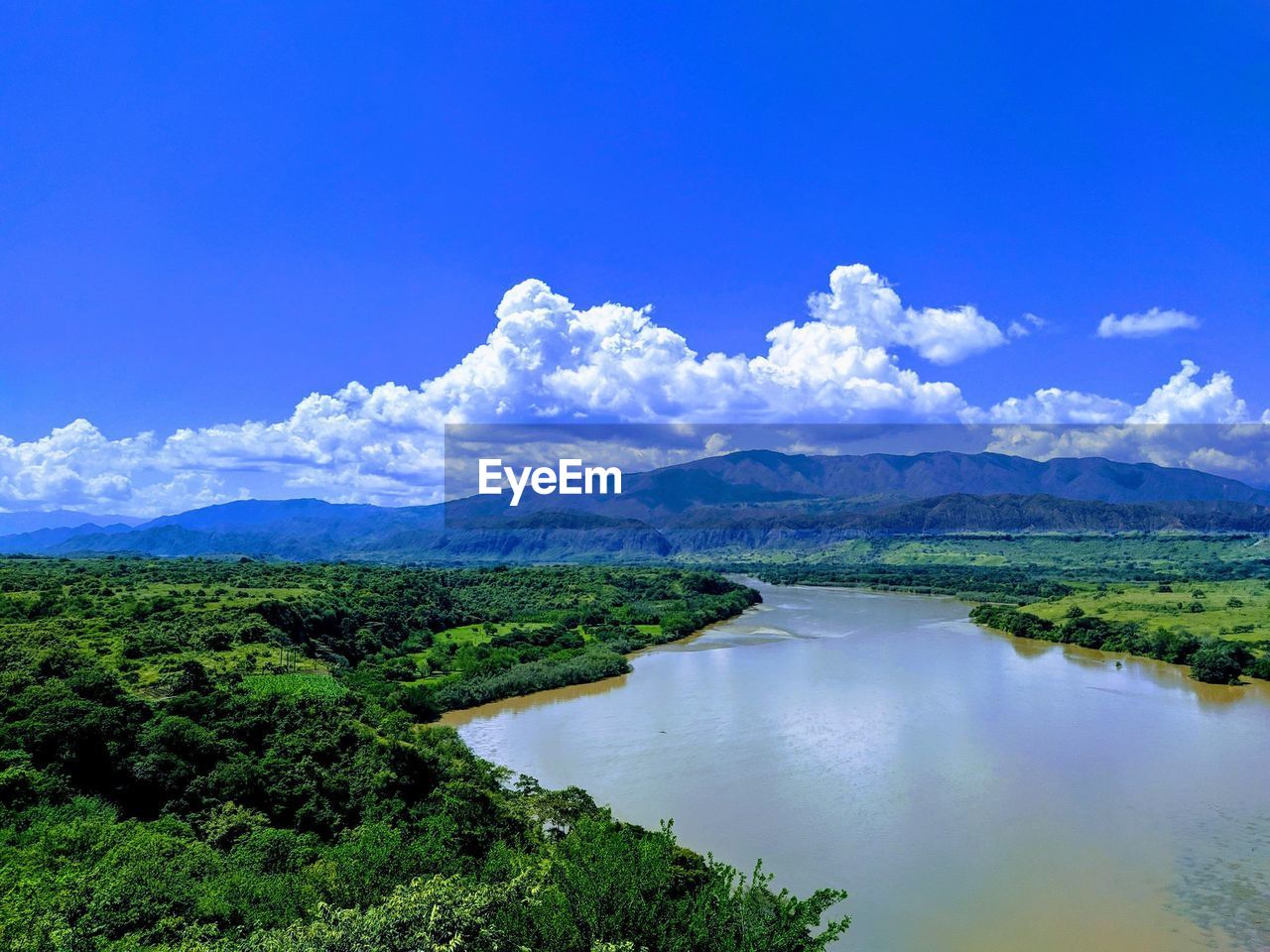 Scenic view of lake against blue sky