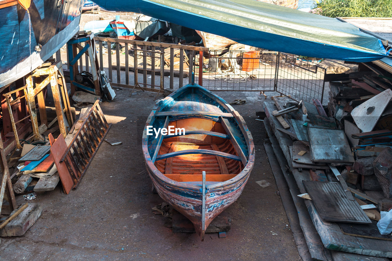High angle view of boat at junkyard