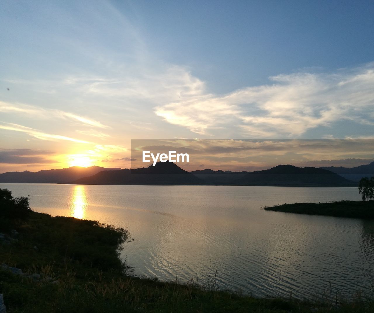 SCENIC VIEW OF LAKE DURING SUNSET