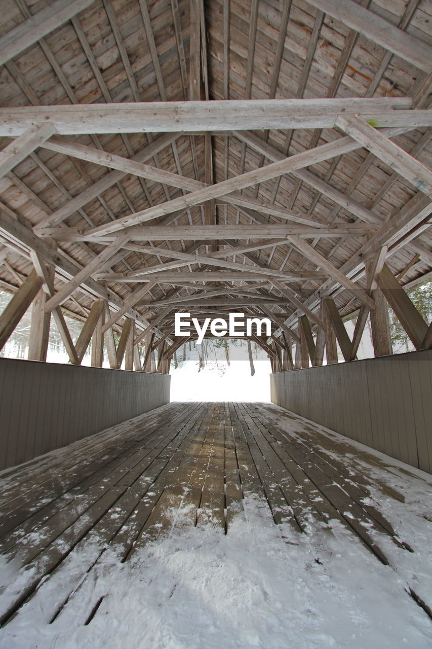 Full frame shot of covered bridge interior. wood post and beam construction 