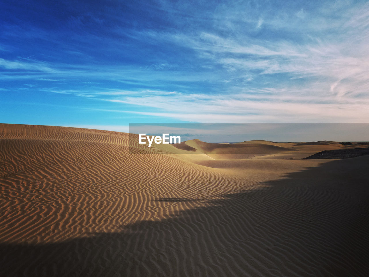 Scenic view of desert against sky