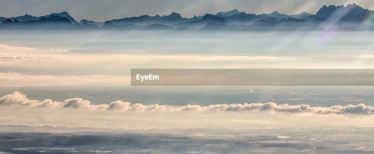 Aerial view of mountains against sky during sunset