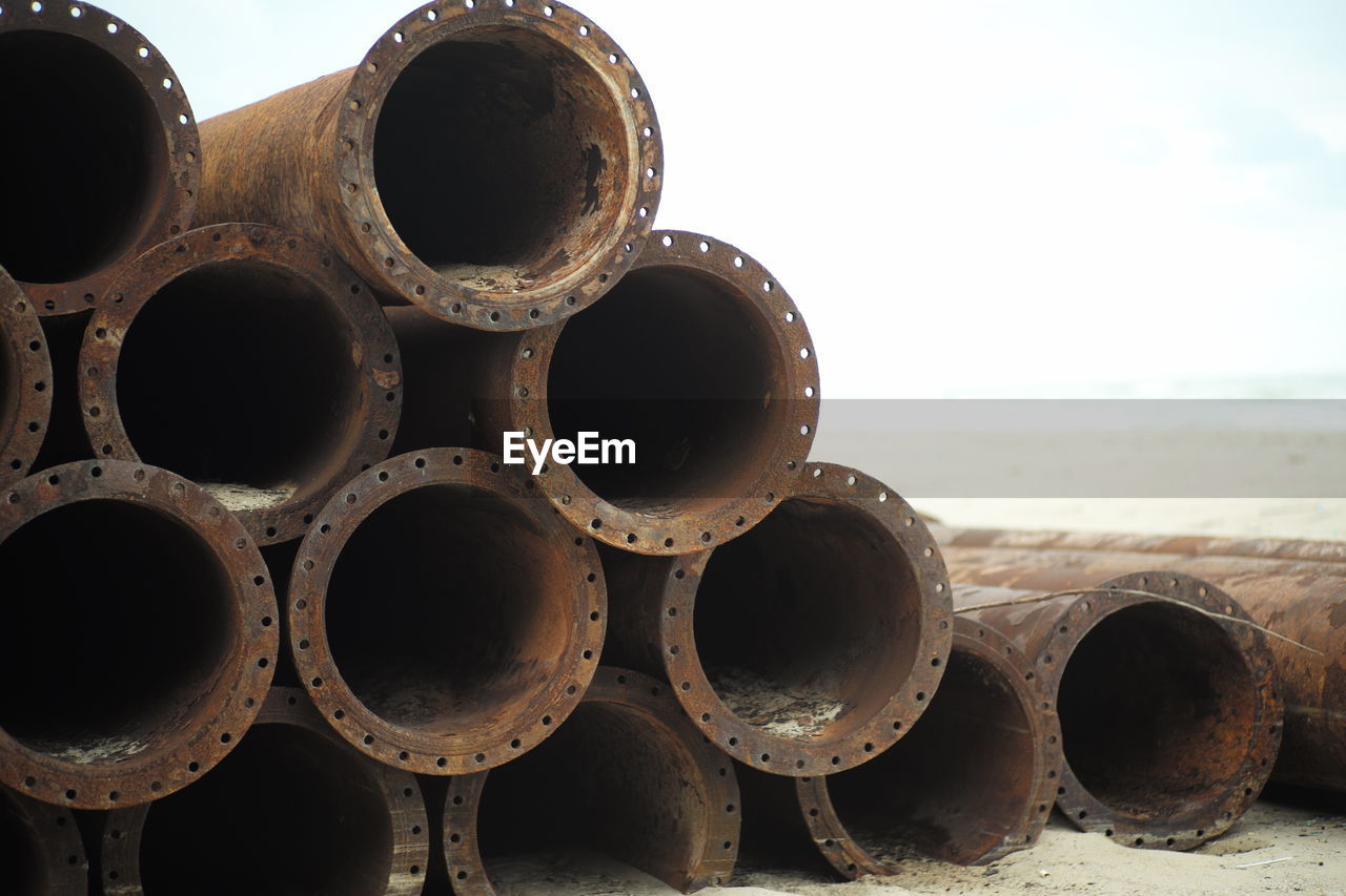 Closeup pile of rusty metal pipes