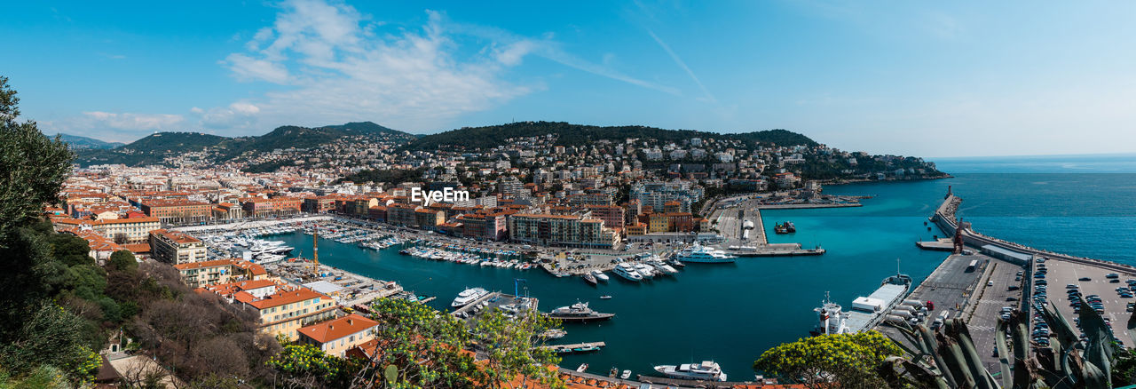 High angle view of townscape by sea