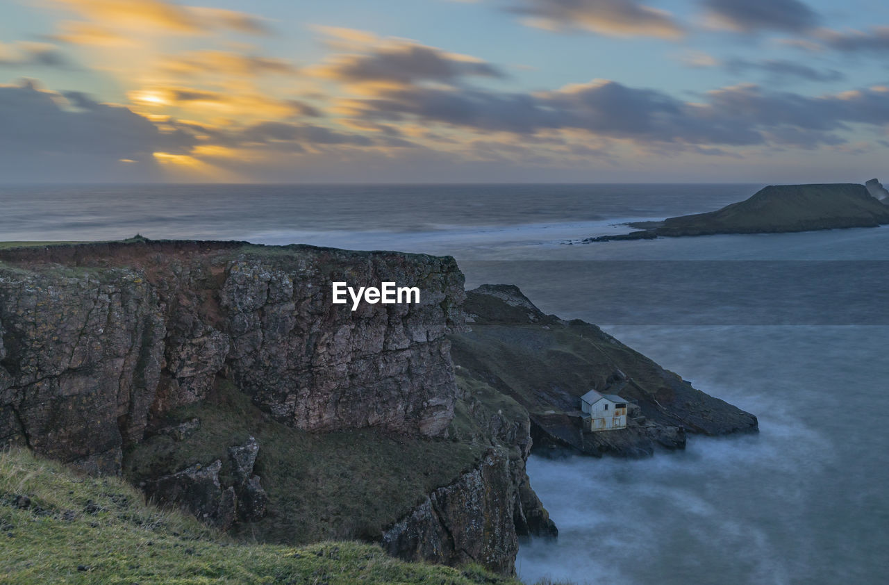 Scenic view of sea against sky at sunset