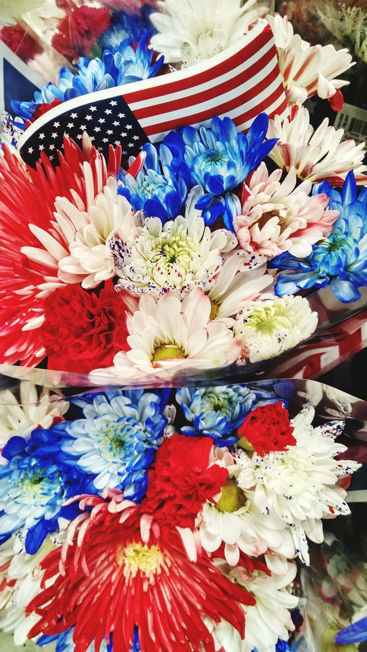 Multi colored flowers for sale in market