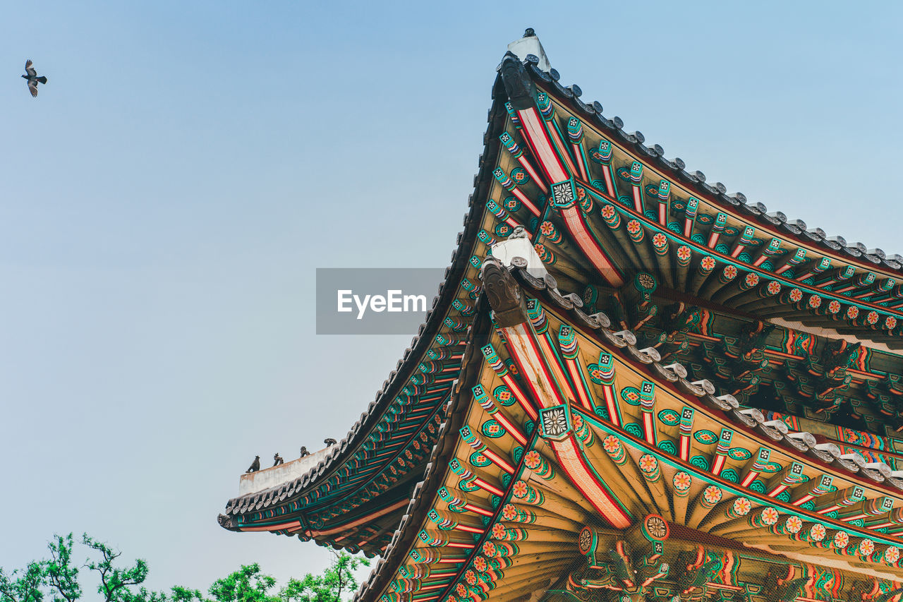 Low angle view of traditional building against sky in korea